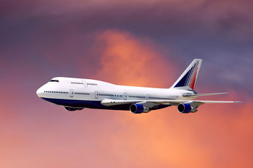 Fototapeta premium airplane in air on sunrise sky