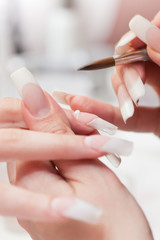 Beauty salon: Manicure, painting on nail