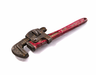 Old and rusty Stilson wrench with red aged handler