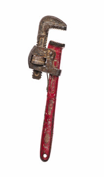 Old and rusty Stilson wrench with red aged handler