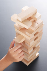 jenga with hand