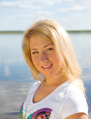 Young  Sexy  woman  riverside.