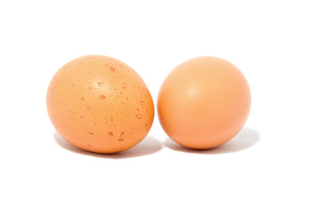 Two chicken eggs isolated on white background