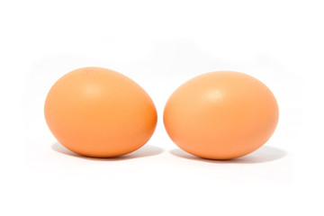 Two chicken eggs isolated on white background
