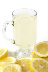 Stock photo of a glass of lemonade with lemon garnish