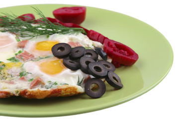 fried eggs and red eggplant