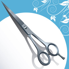 Hairdresser's scissors on a white and blue background