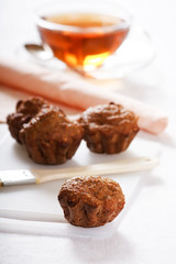 Baked muffins with tea