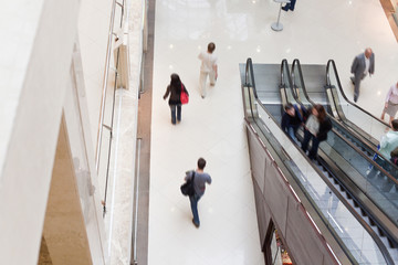 Modern shopping hall with escalator