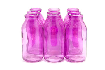 Pink bottles together isolated on white background