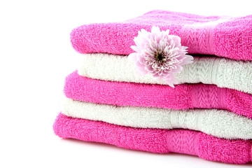 Obraz na płótnie Canvas Towels and flower isolated on white background