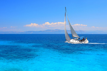Sailing yacht in turquoise waters