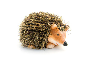 wooden hedgehog isolated on white background © Sandra van der Steen