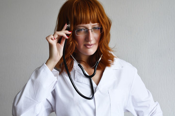 Female doctor lesten to her thoughts with stethoscope