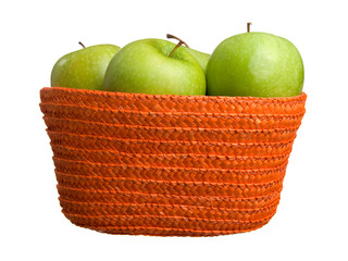 green apples in a basket on white background