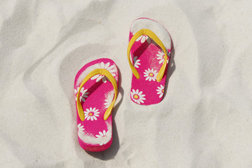 flip flops in beach sand