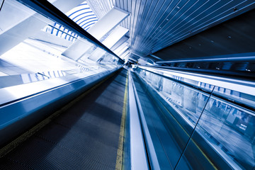 Moving escalator in the office hall