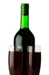 Bottle and wine glass on reflective background