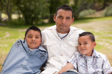 Obraz premium Father and Sons in the Park