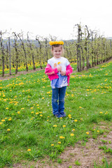 5 years old girl wearing dandelion garland