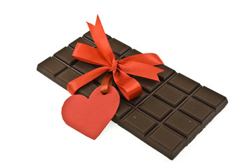 Black chocolate with red ribbon and tag 