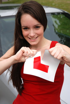 Teenage girl ripping up her L plate