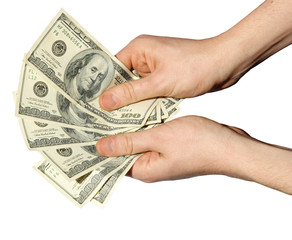 Money in a hand on a white background