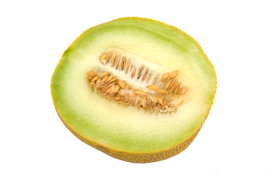 yellow melon in half isolated on white background