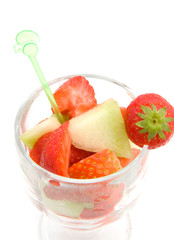 glass with fruits isolated on white background