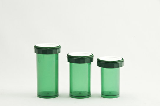 Three Green Medicine Bottles