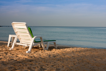 a chair facing the sea