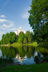 Fototapeta na wymiar Medieval castle over lake scene
