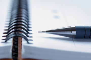 Close up of a pen on a note pad