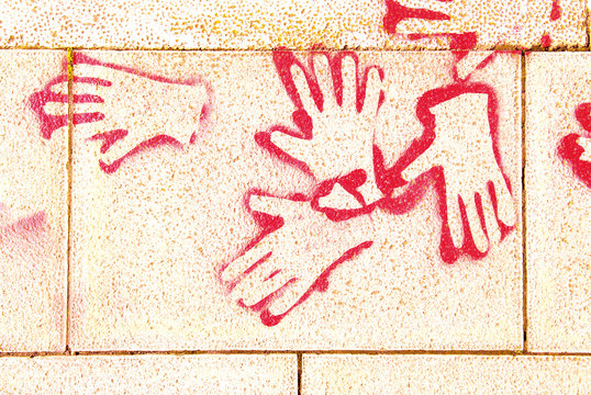 red hands painted on street in barcelona spain