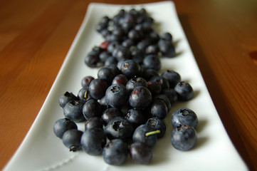Fresh Blueberries on white plate