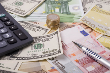 Money, pen and calculator