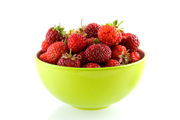 Green bowl with fresh and tasty strawberries on white background