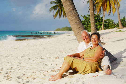 happy european seniors on tropical beach in cuba