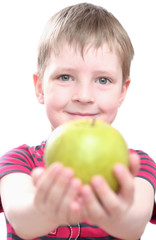 Fototapeta na wymiar a boy gets on the hip an apple