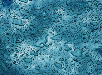 Drops of water on a glass surface (as a background)