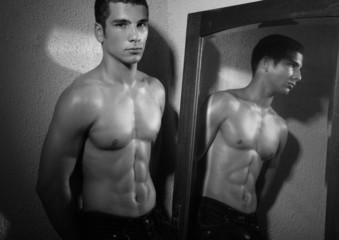 Fototapeta na wymiar Male model with a mirror