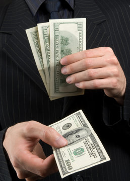 businessman holds money in hands