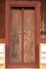 Old wood door of Buddhist church, Thailand