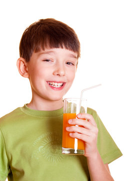 Smiling boy with a glass of juice