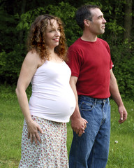 Young Pregnant Couple Holding Hands