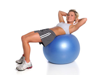 Fototapeta premium Woman Exercising On Fitness Ball