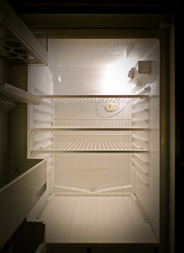 Empty fridge interior, frontal view