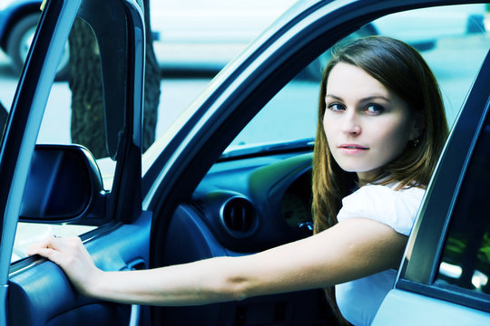 Young woman in a car.