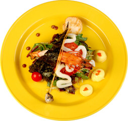 lettuce with a shrimp by a squid, fish and red caviar