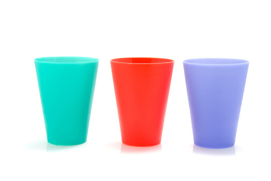 Three colored lemonade cups isolated on white background